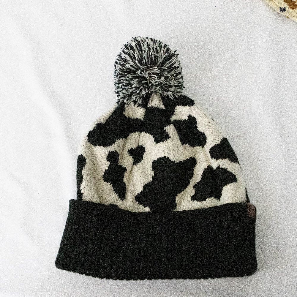 Cow Print Women's Knitted Toboggan with a Puff Top (Black and White)